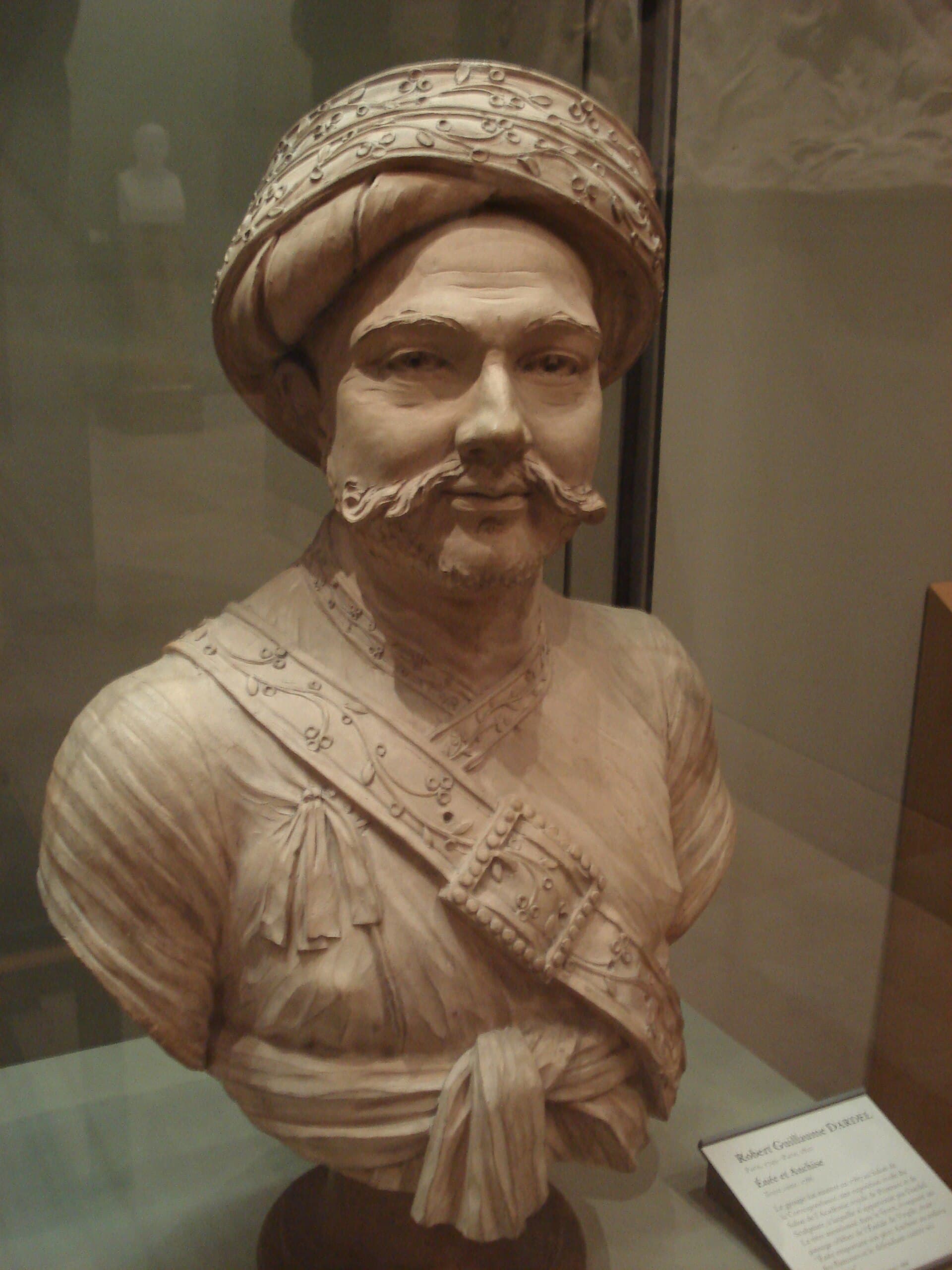 Marble portrait bust of a bearded man in a turban, carved in the neoclassical manner.