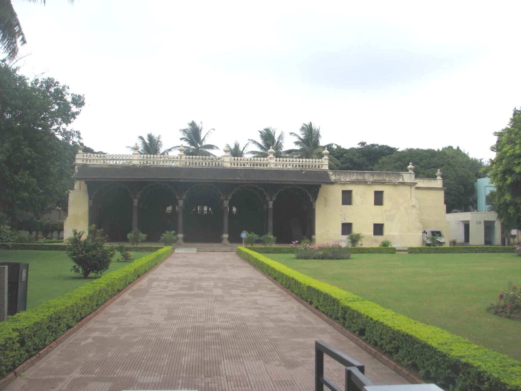 The two-storey teak summer palace at Bangalore, with arched colonnades on both floors and ornamented balconies.