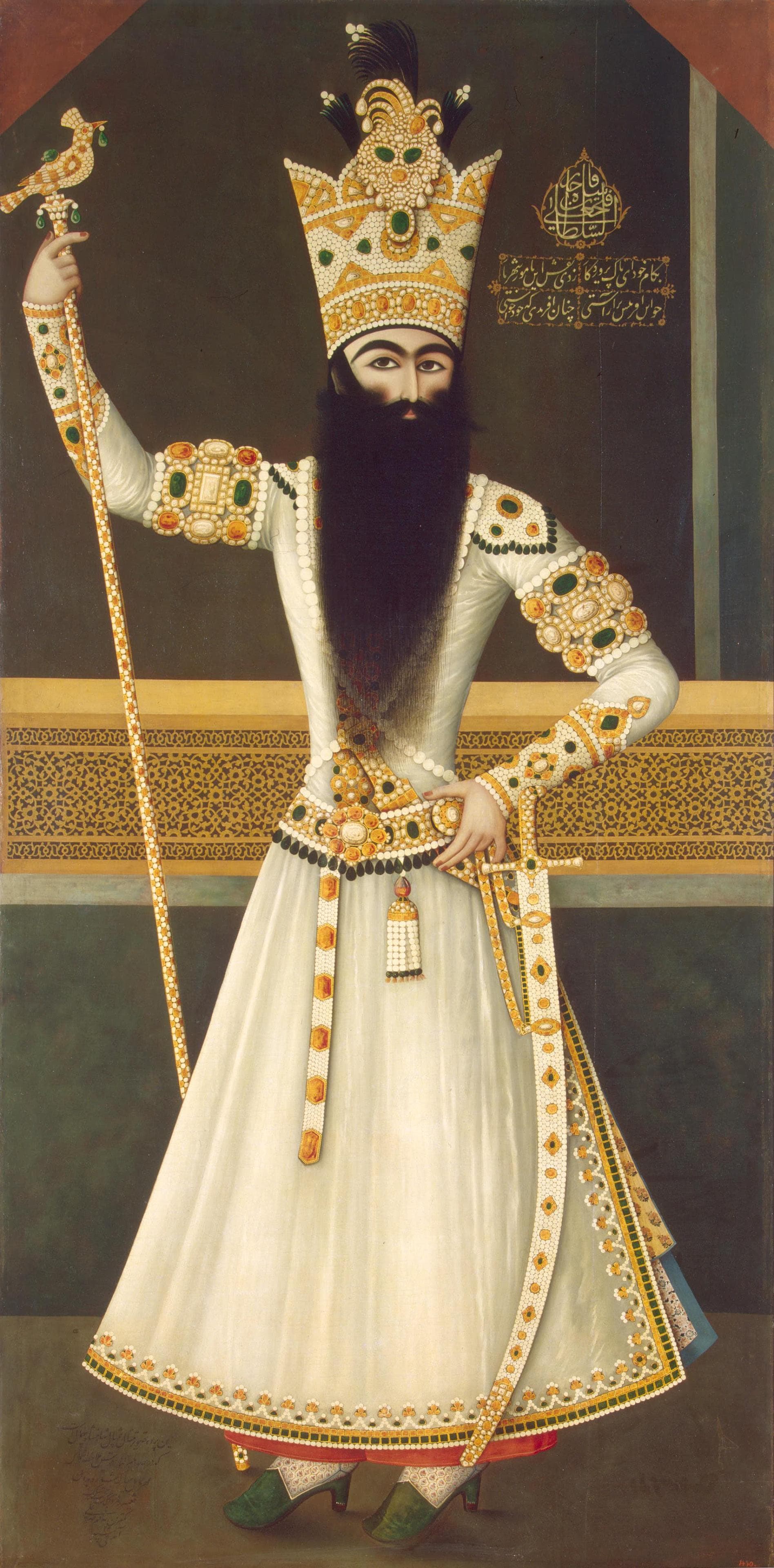 Full-length Qajar portrait of Fath Ali Shah standing in jewelled robes with a long black beard.