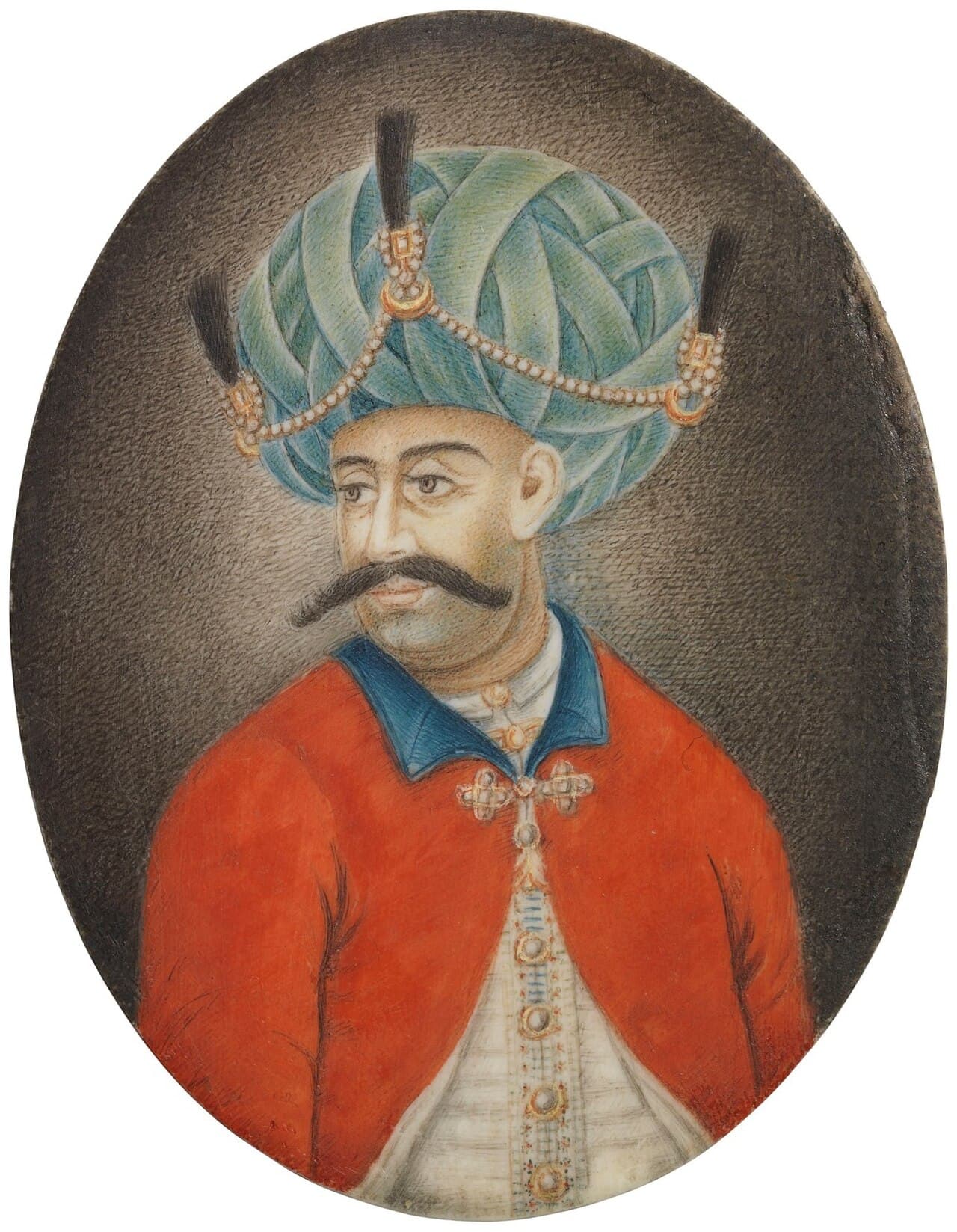 Miniature portrait of Haidar Ali in a large pale-green turban with jewelled ornaments and plumes, wearing a red tunic.