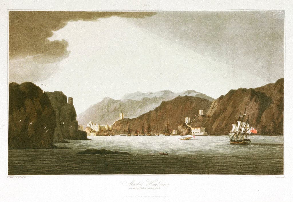 Aquatint view of Muscat harbour: dhows at anchor beneath bare rock headlands crowned with watchtowers.